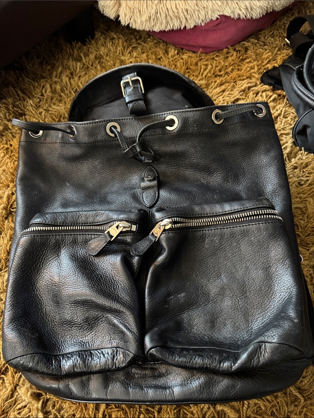 Coach Unisex Black Leather Drawstring Backpack with silver hardware.